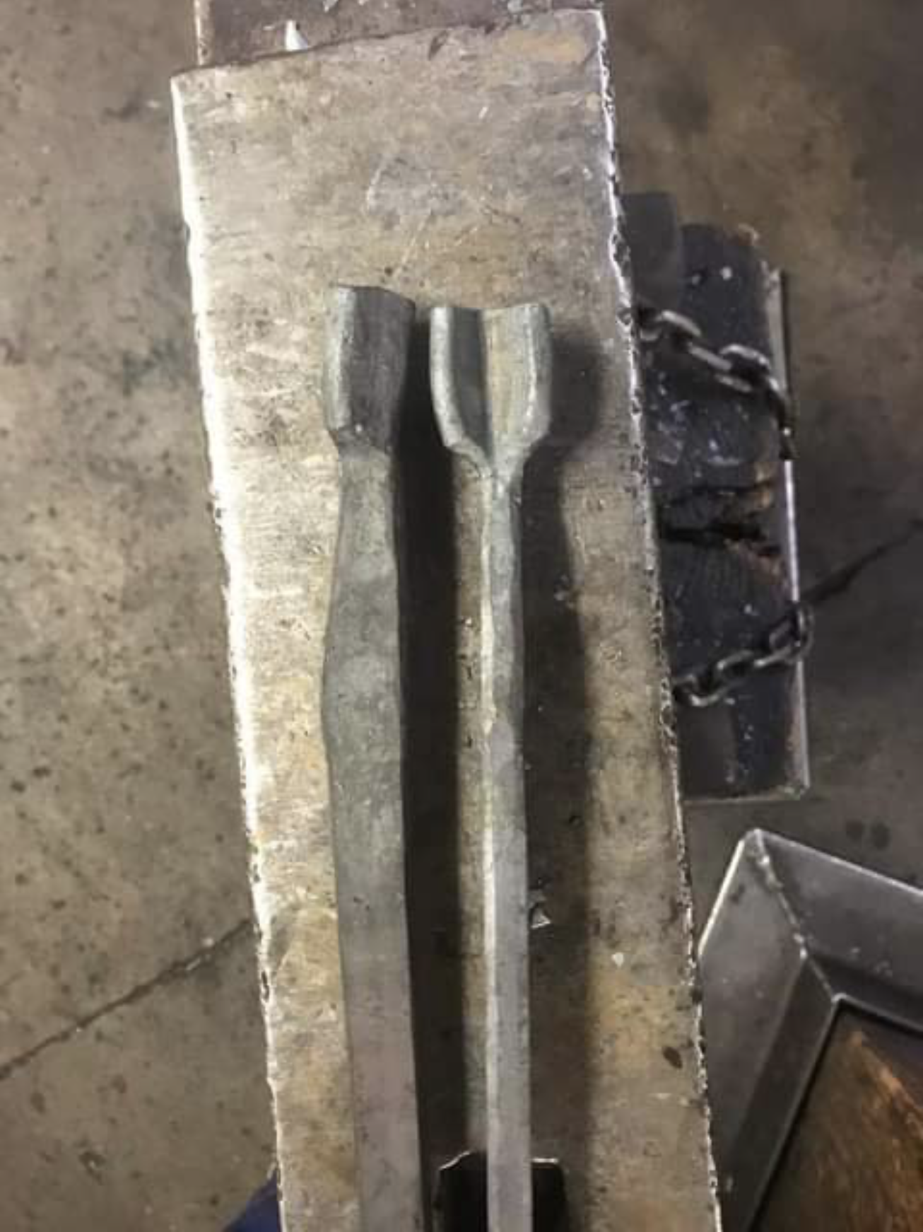 Two sides of a pair of tongs